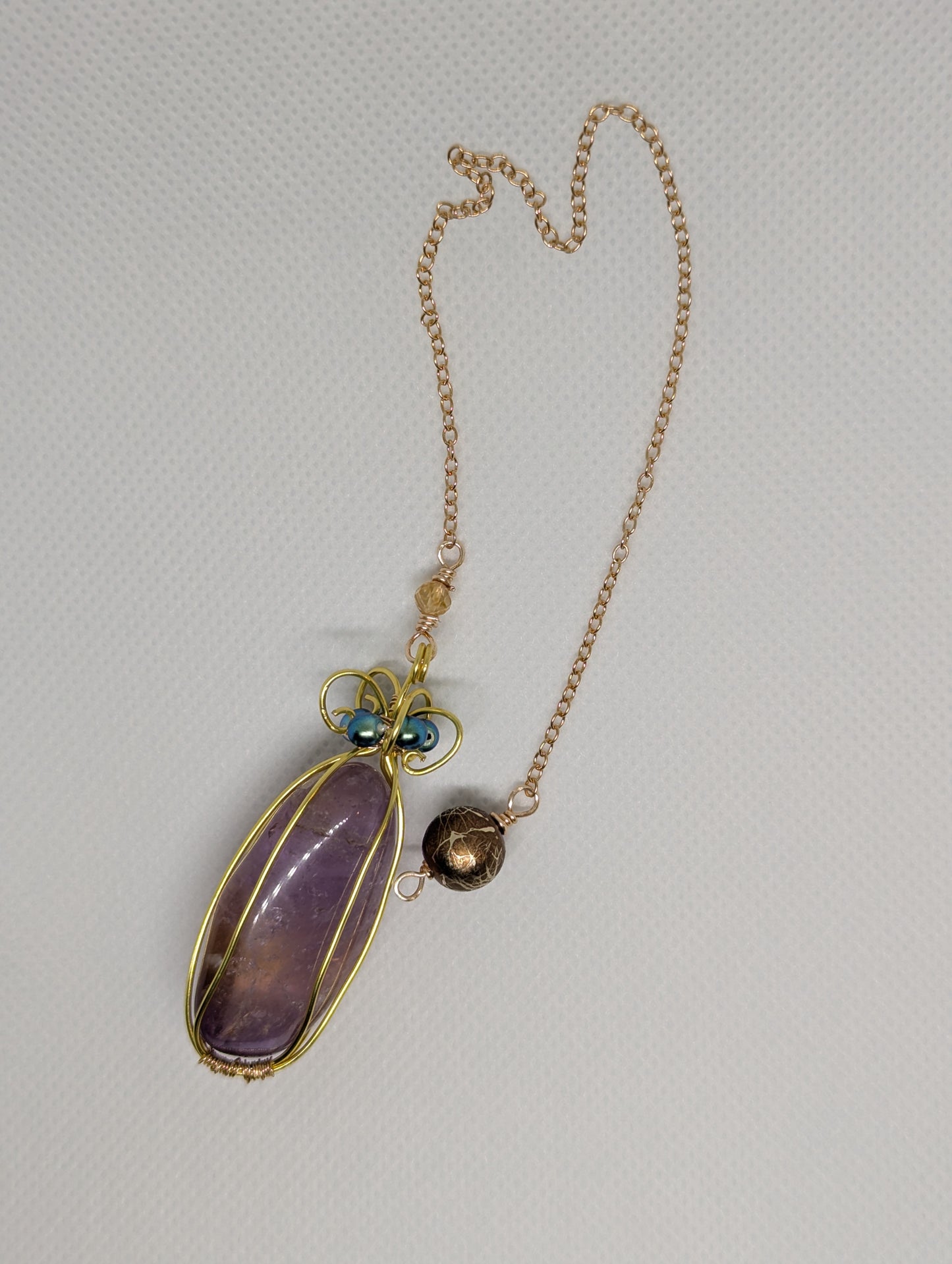 PENDULUM - Anetrine (amethyst & citrine) wrapped with Gold-colored wire